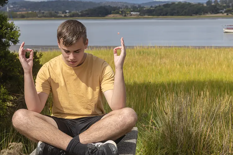A teenager relaxing peacefully at home in the evening